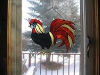 rooster struts across the window