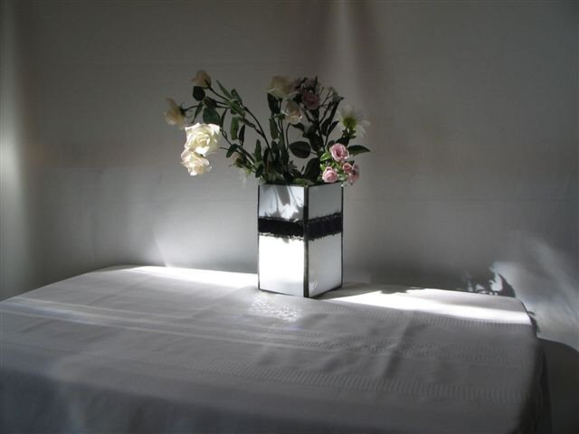vase-is-made-of-white-glass-with-purple-mirrored-glass-trim.jpg