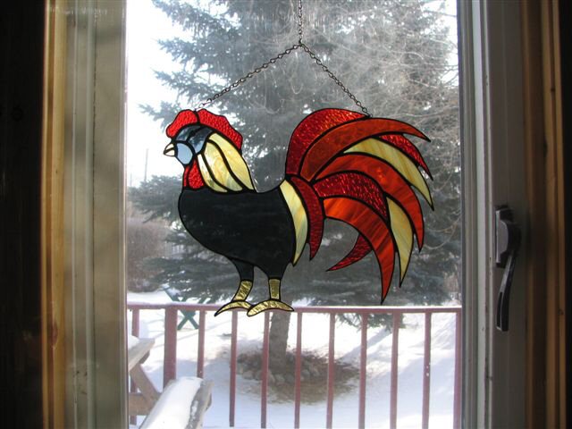 rooster-struts-across-the-window.jpg